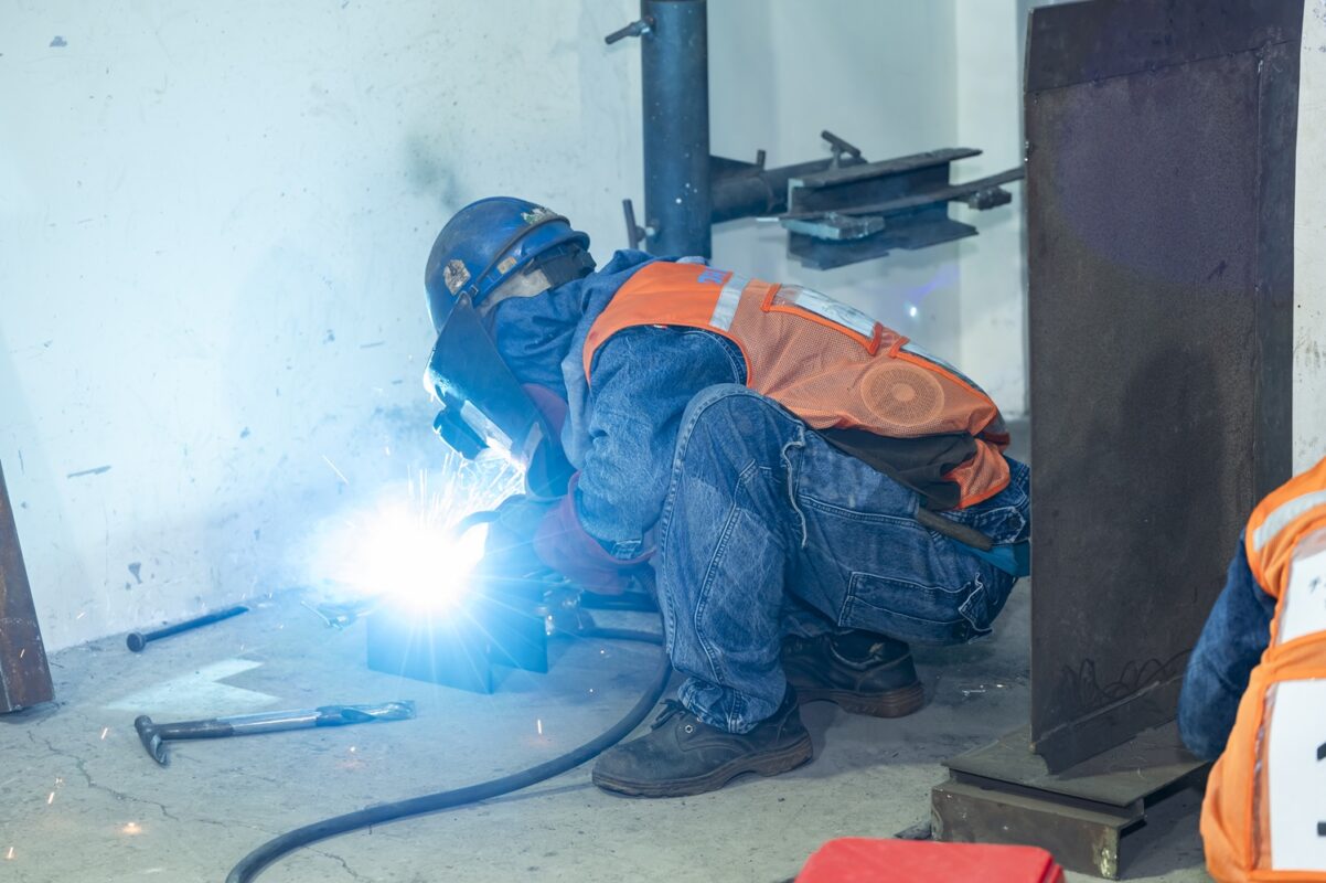 Students take the practical exam at the Welding Training Center of DDC